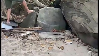 A Group Sex Party On The Beach With Voyeuristic Spectators